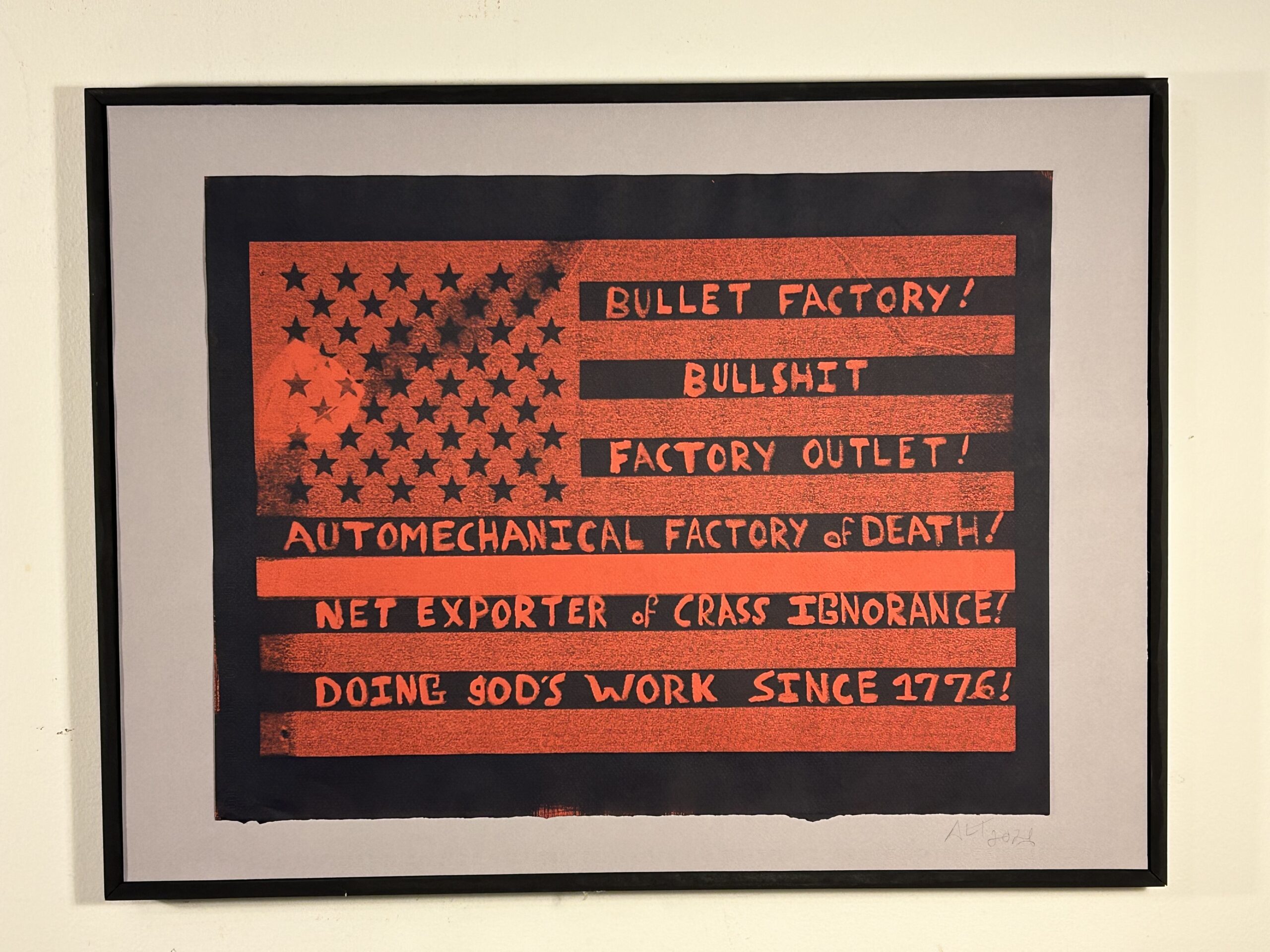 Cyanotype image of a USA flag on red paper. On the dark stripes of the flag is the text: "Bullet Factory! Bullshit Factory Outlet! Automechanical Factory of Death! Net Exporter of Crass Ignorance! Doing god's Work Since 1776!"